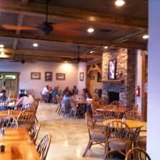Image 3: A well-lit, inviting dining area features a promin