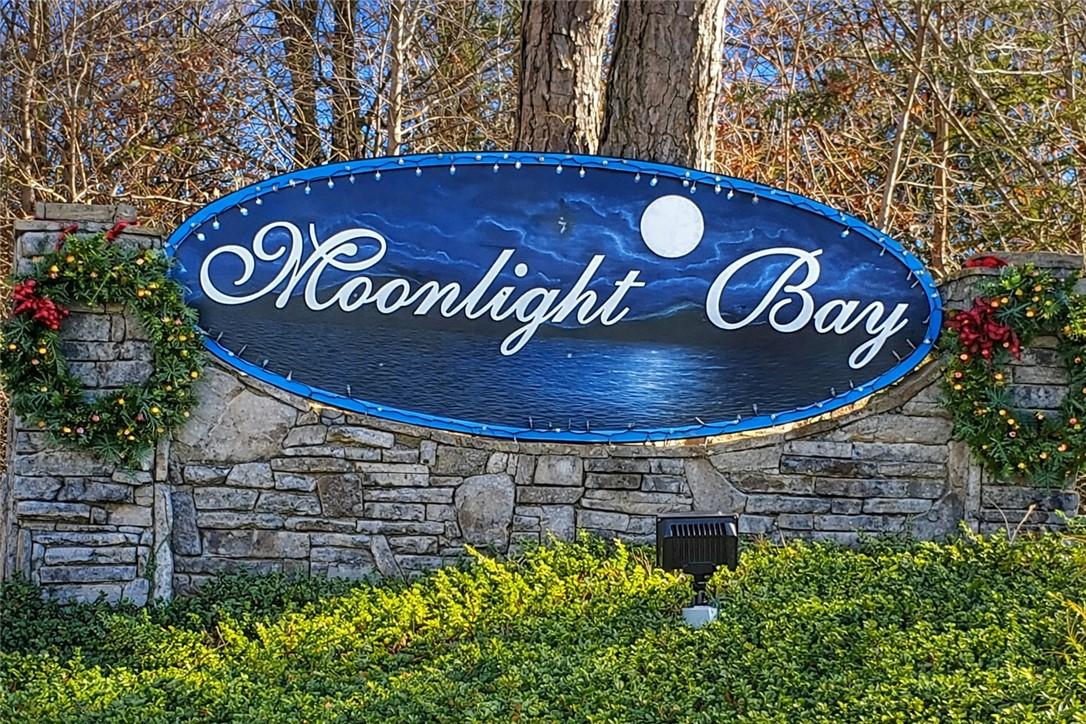 Image 4: Enter a community where moonlight reflects on tran