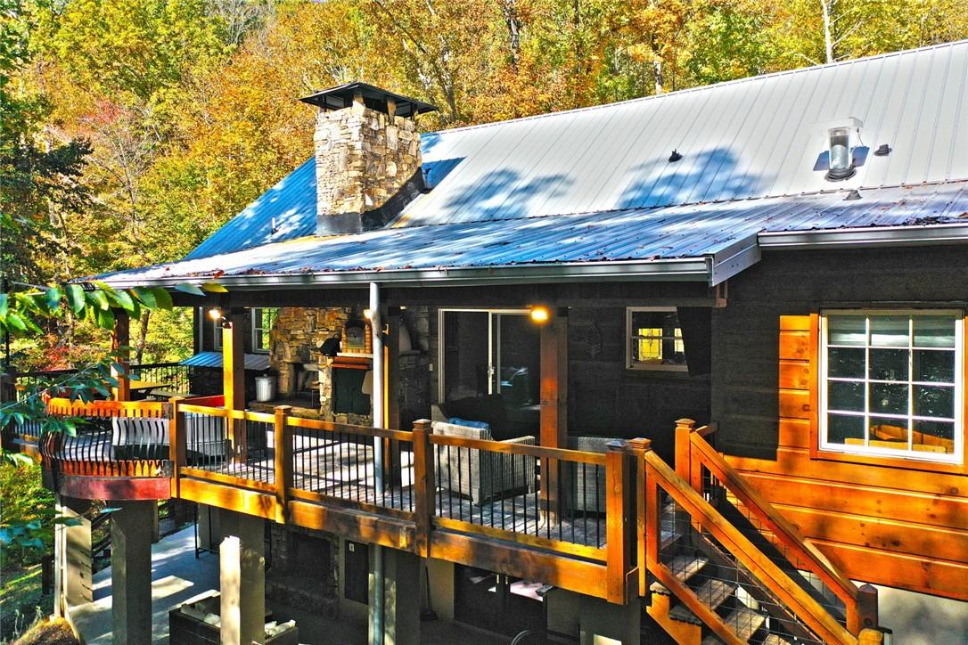 Image 3: This charming home offers outdoor living with an i