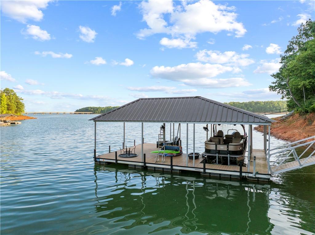 Image 4: Boasting a private covered dock, this waterfront h
