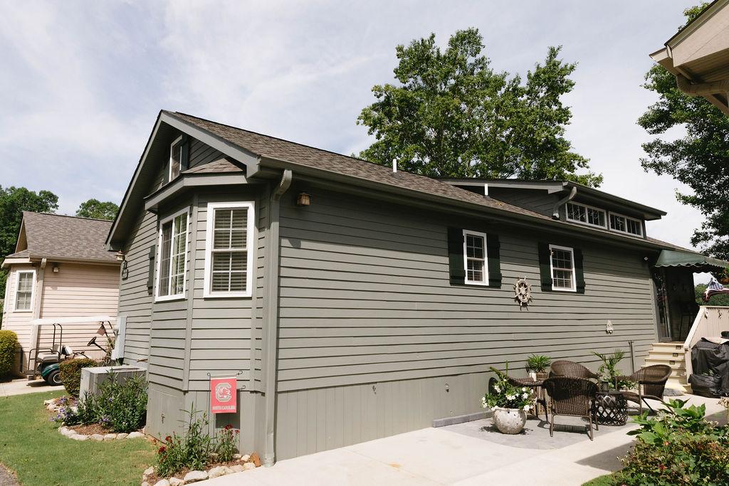 Image 1: This charming home features classic horizontal sid
