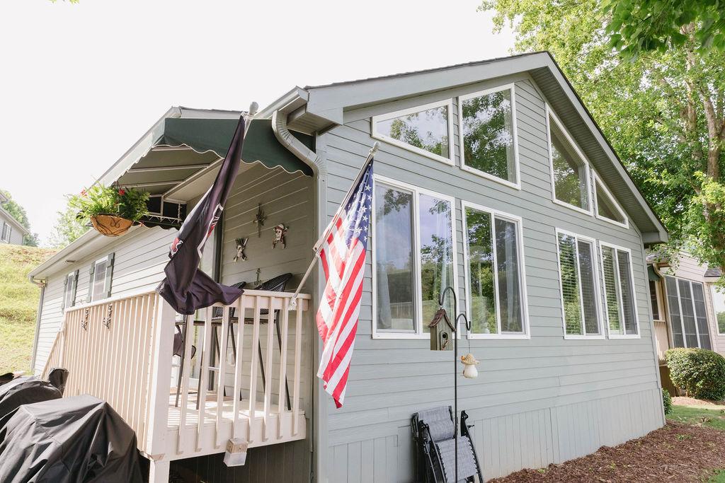 Image 2: This house features a charming outdoor living spac