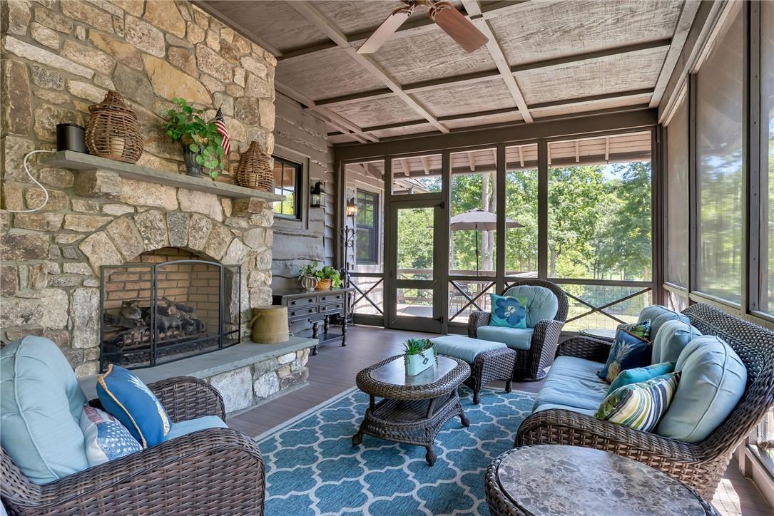 Image 4: An inviting screened porch featuring a majestic st