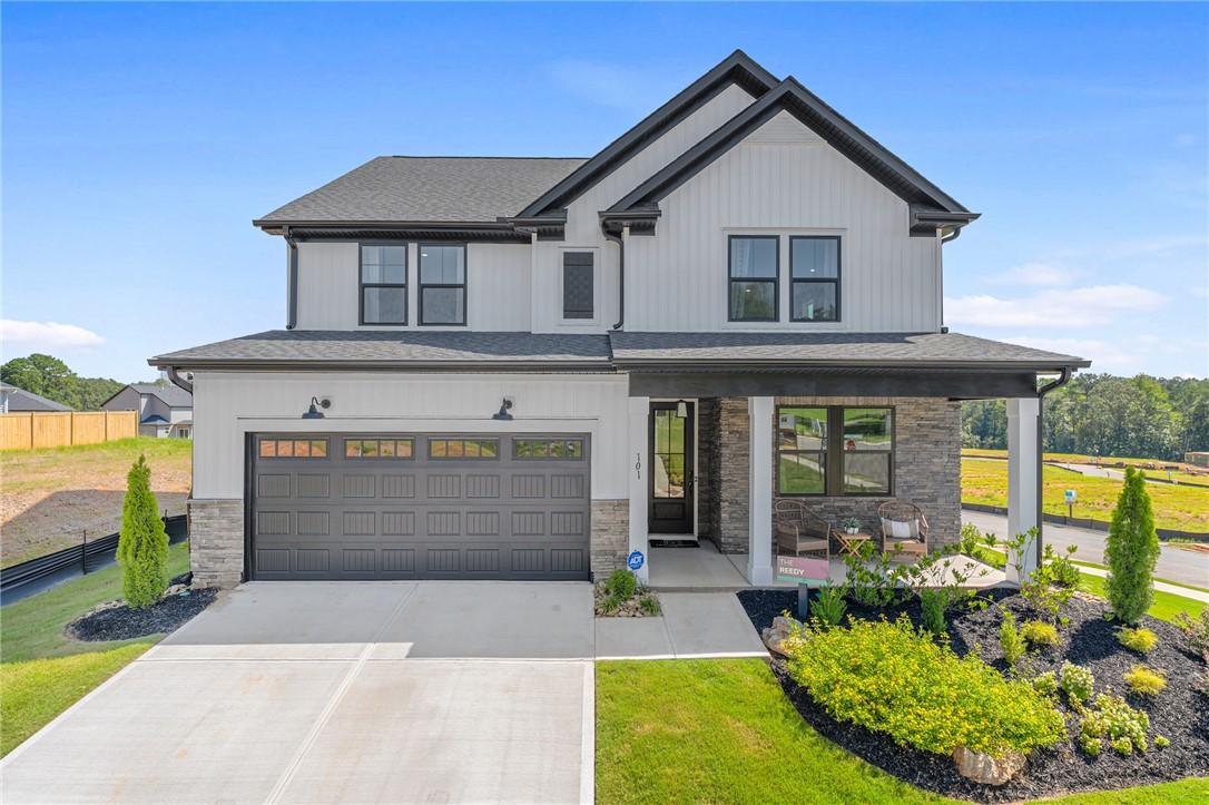 Image 2: This modern farmhouse style home features a welcom