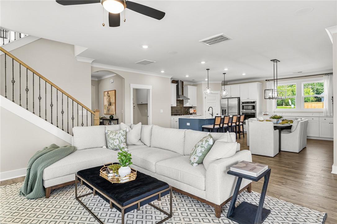 Image 3: This bright and airy living space offers an open l