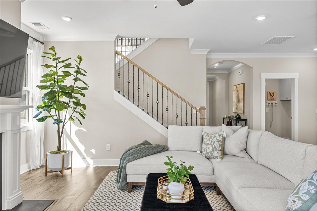 Image 4: This bright living area features ample natural lig