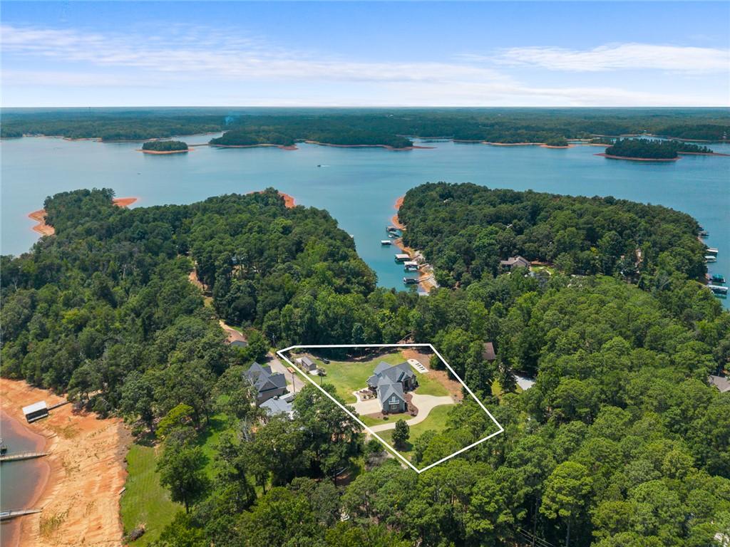 Image 3: An aerial perspective reveals a private waterfront
