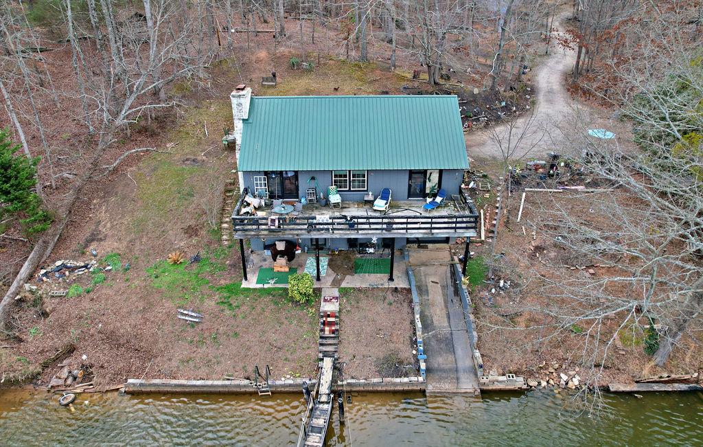 Image 1: This captivating lakefront home offers a private d