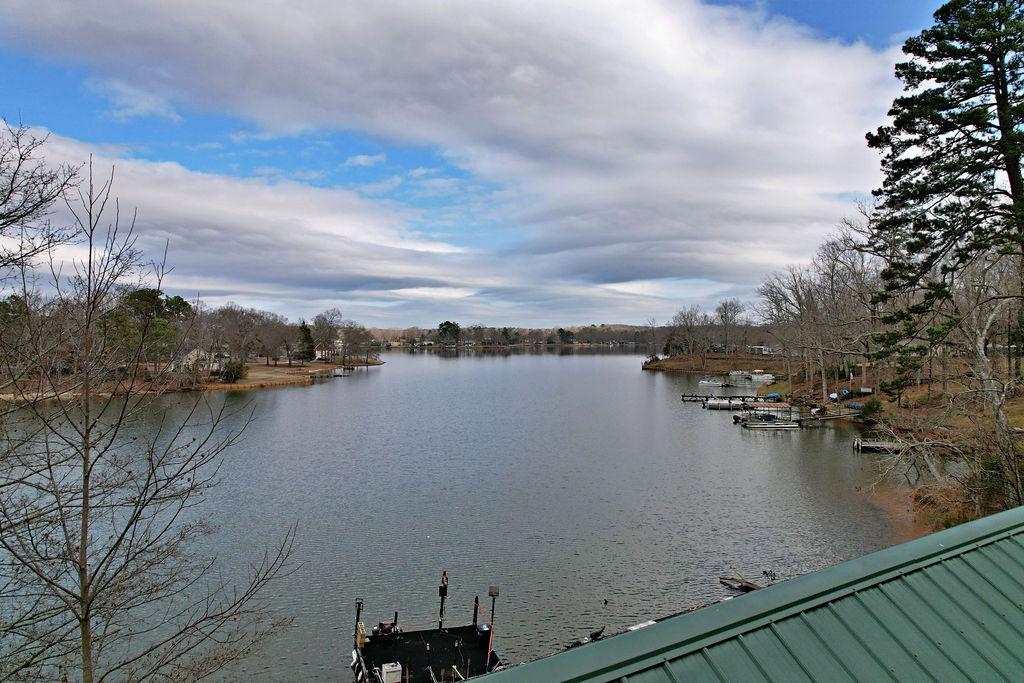 Image 2: This serene lakefront property offers picturesque