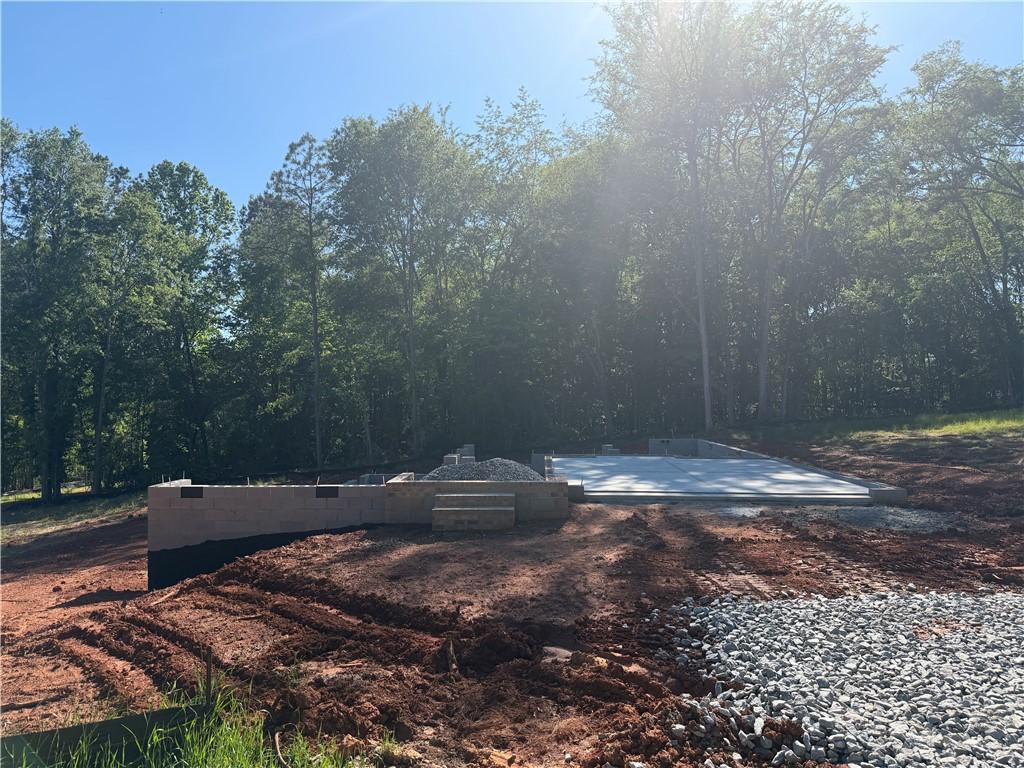 Image 1: A newly laid concrete foundation awaits its future