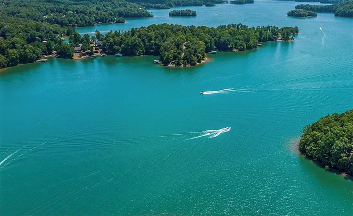Image 1: This aerial view showcases a vibrant lake surround