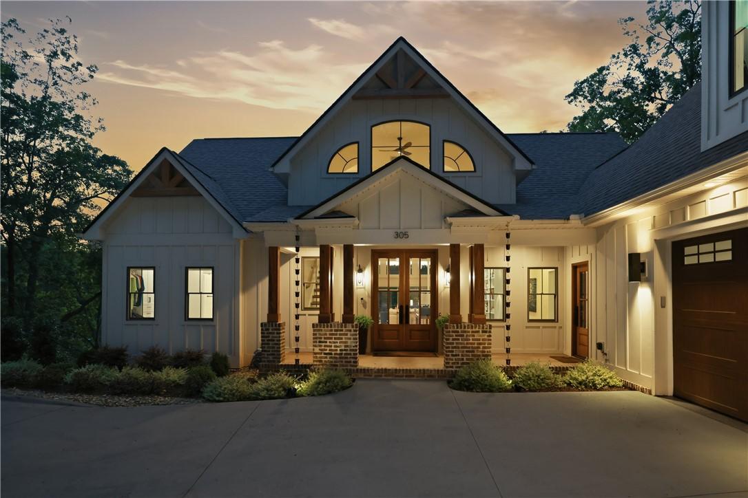 Image 2: A charming Craftsman-style home presents a welcomi