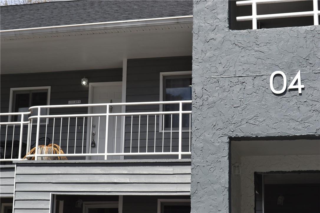 Image 1: This dwelling features a charming balcony, perfect