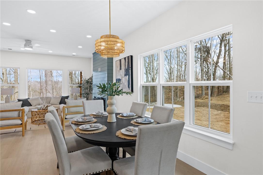 Image 3: This bright dining area offers an open floorplan w