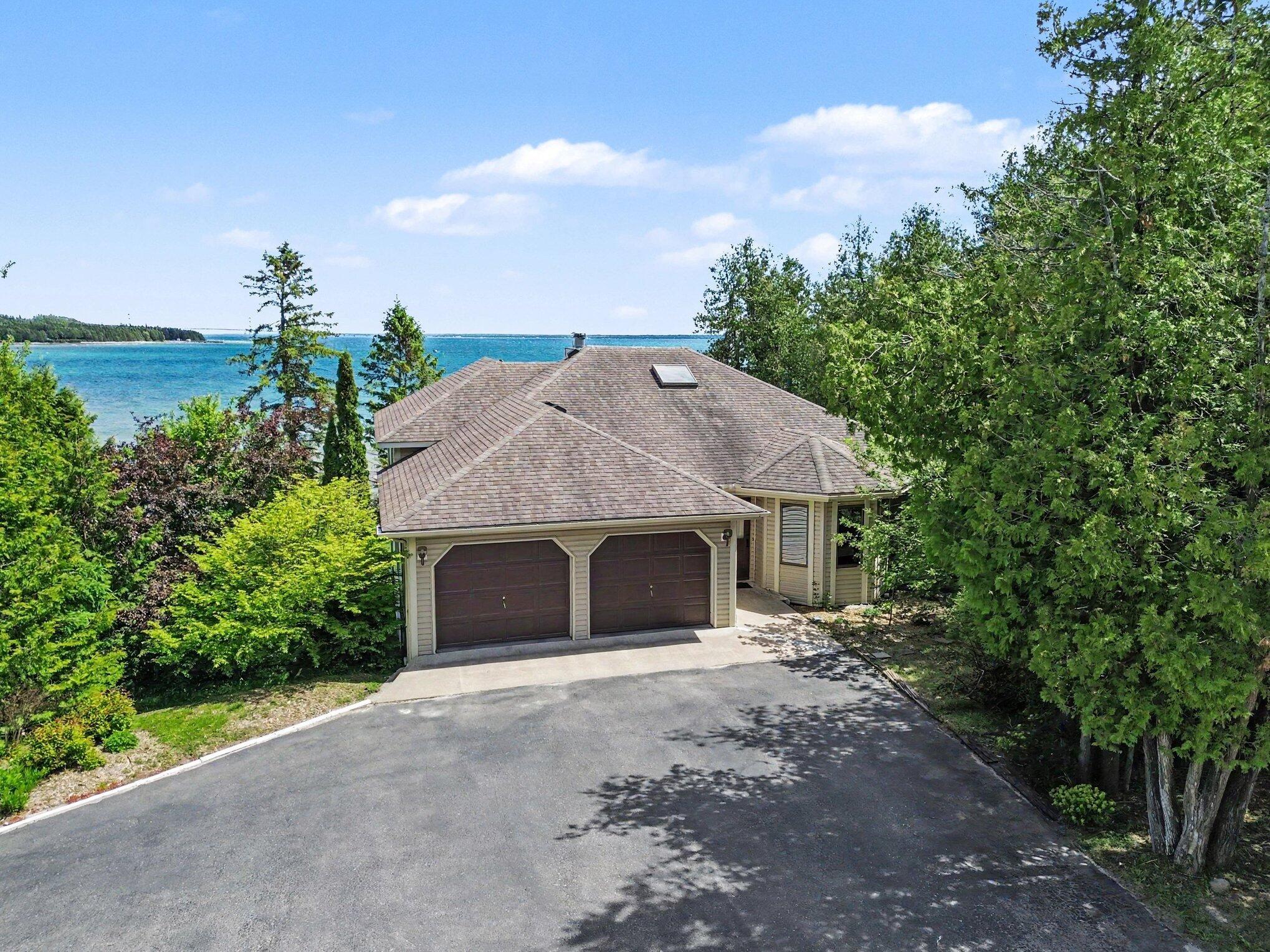 Image 2: Driveway into 2 car attached garage